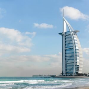 Stunning view of Burj Al Arab with a serene beach setting in Dubai, UAE.